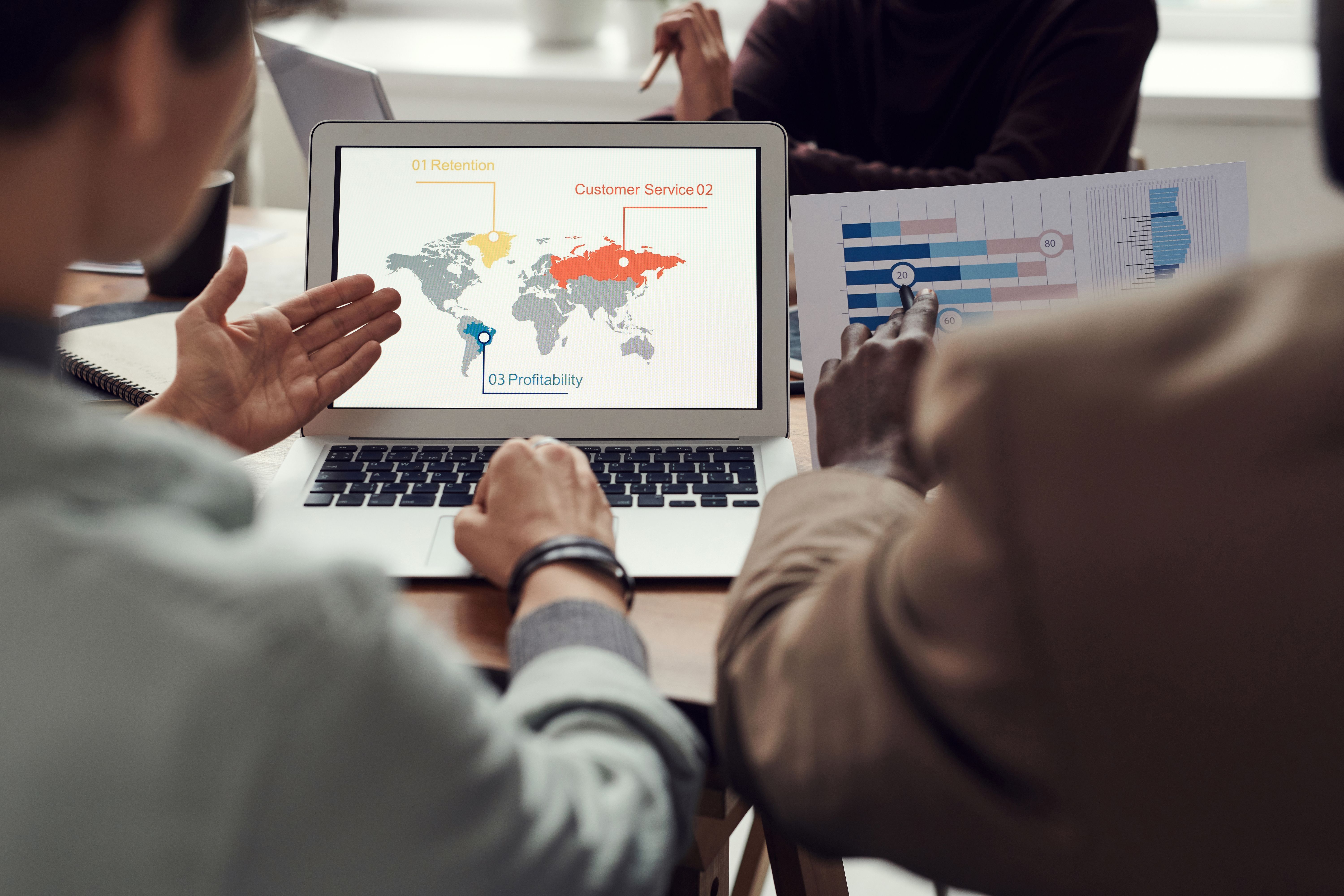 Financial analyst or Asian businesswoman analyzing and compare detailed financial reports, taxes, ma